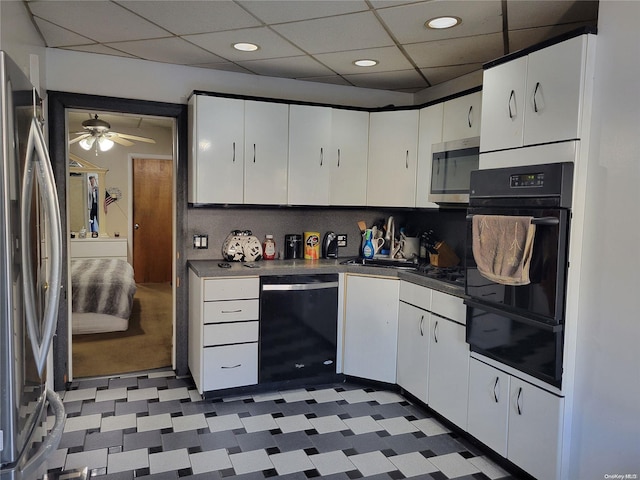 kitchen featuring ceiling fan, white cabinetry, sink, and appliances with stainless steel finishes