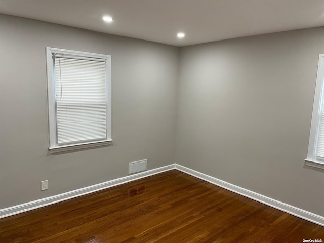 unfurnished room featuring hardwood / wood-style floors