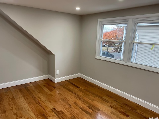 unfurnished room featuring hardwood / wood-style floors