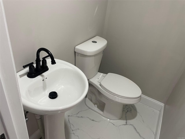 bathroom with sink and toilet