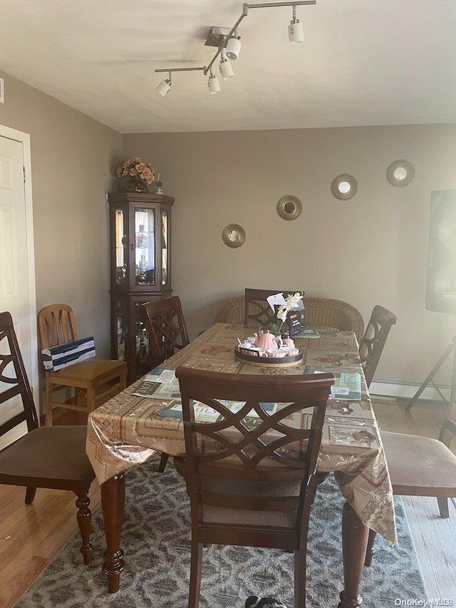 dining area featuring wood-type flooring