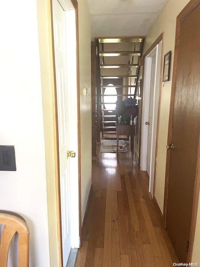 hallway featuring dark hardwood / wood-style flooring