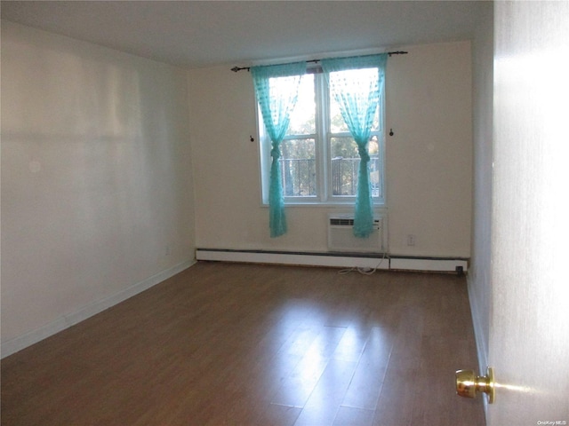 unfurnished room with wood-type flooring, a baseboard radiator, and a wall mounted AC