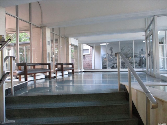 stairway featuring crown molding