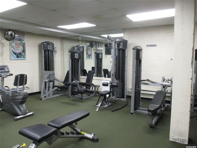 workout area with a drop ceiling