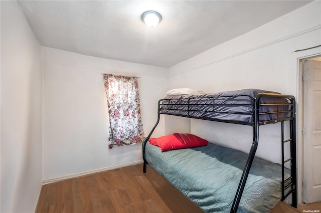 bedroom with wood-type flooring