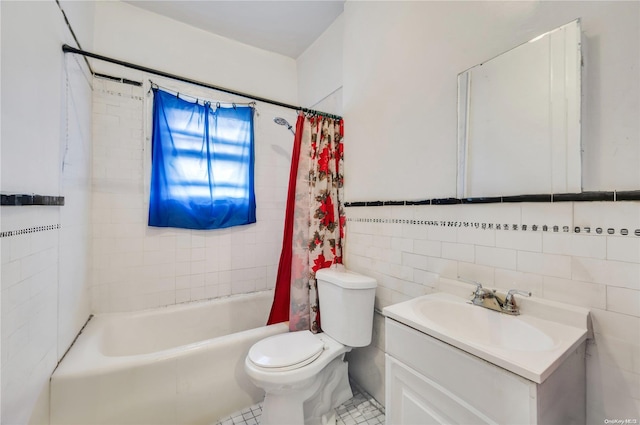 full bathroom with shower / bath combo, vanity, tile patterned floors, toilet, and tile walls