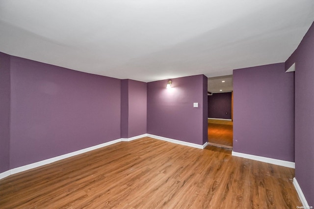 unfurnished room featuring hardwood / wood-style flooring