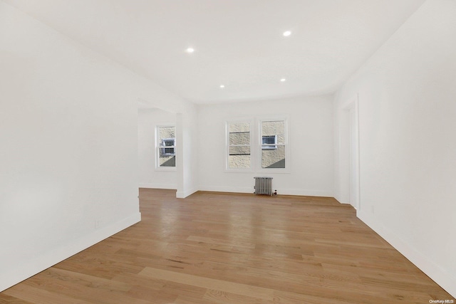 interior space featuring radiator and light wood-type flooring