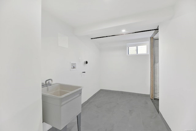 laundry room featuring washer hookup and sink