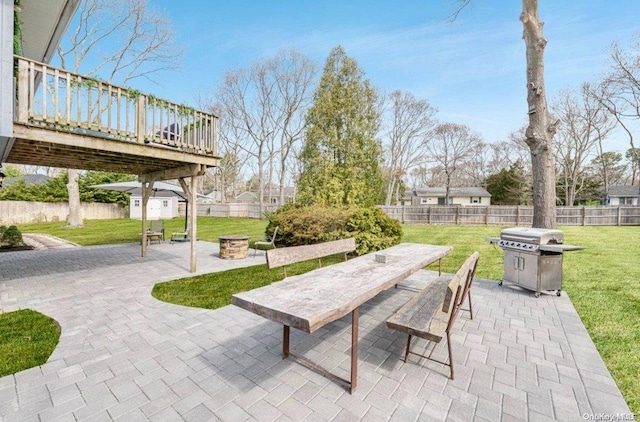 view of patio / terrace featuring grilling area and a wooden deck