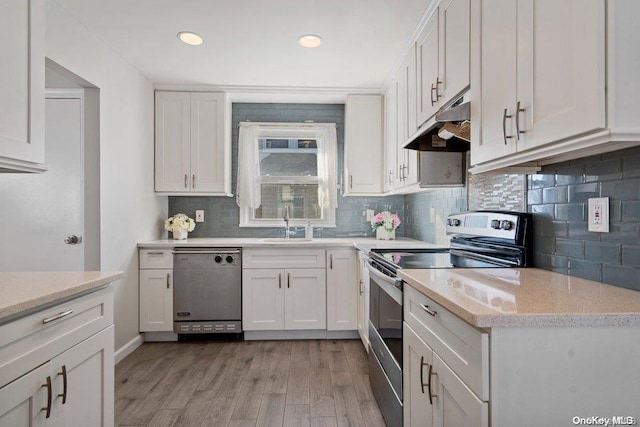 kitchen featuring white cabinetry, black dishwasher, light hardwood / wood-style floors, and electric range