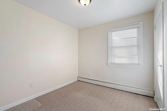 unfurnished room featuring a baseboard radiator