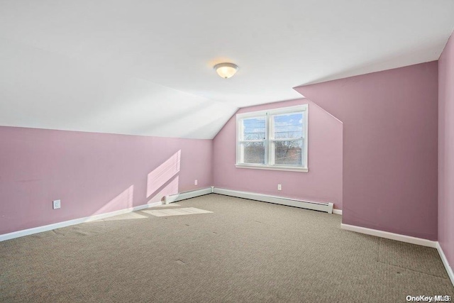 bonus room with a baseboard heating unit, lofted ceiling, and carpet floors