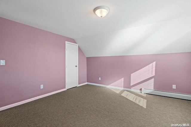 additional living space featuring lofted ceiling and carpet floors