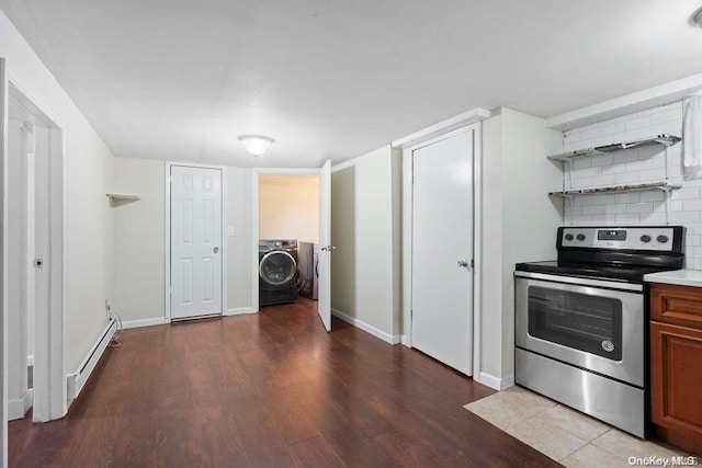 kitchen with a baseboard radiator, washer / dryer, wood-type flooring, decorative backsplash, and stainless steel electric range