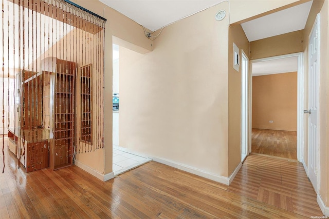 hallway featuring wood-type flooring