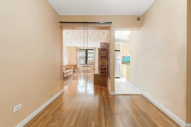 hall with light wood-type flooring