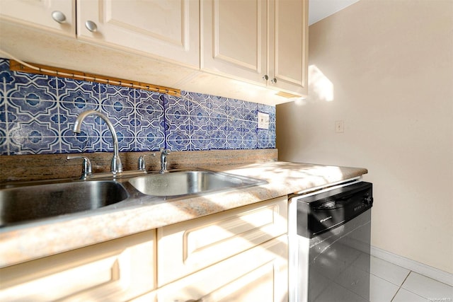 kitchen with dishwasher, light tile patterned floors, backsplash, and sink