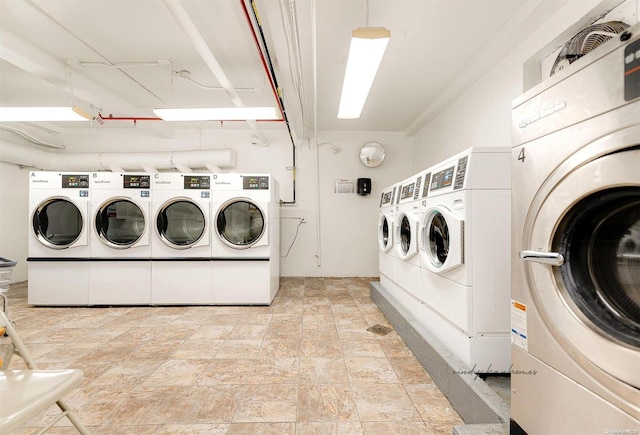 clothes washing area featuring washing machine and clothes dryer