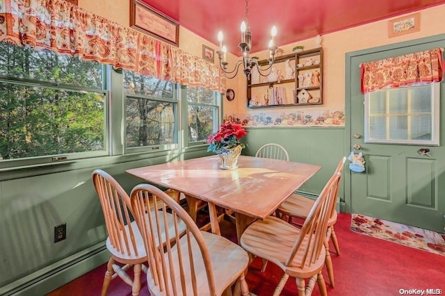 529 Birch Hollow Dr, Shirley, NY 11967 - dining room featuring a chandelier, baseboard heating, and a wainscoted wall
