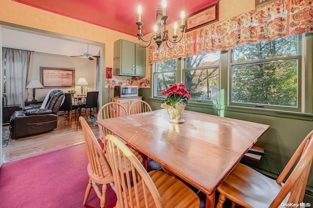 529 Birch Hollow Dr, Shirley, NY 11967 - dining room with a chandelier, a ceiling fan, and wood finished floors