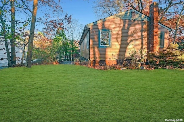 529 Birch Hollow Dr, Shirley, NY 11967 - view of property exterior with a lawn and a chimney