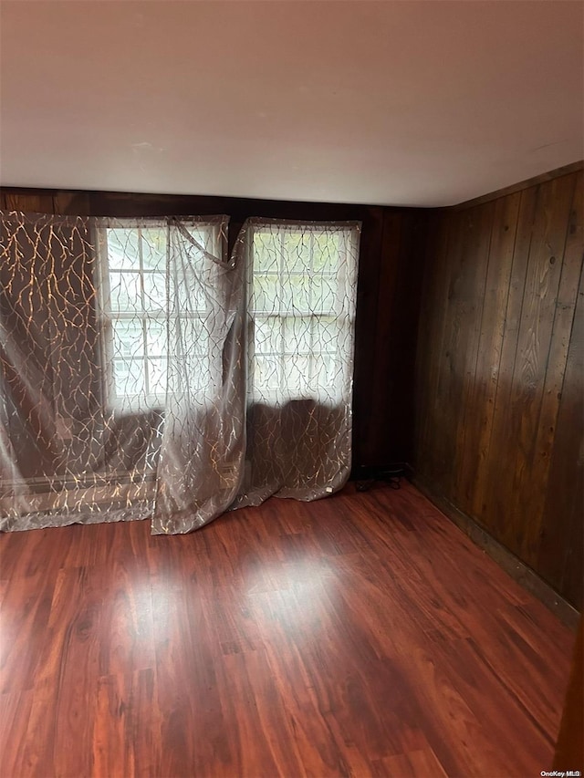 empty room with hardwood / wood-style flooring