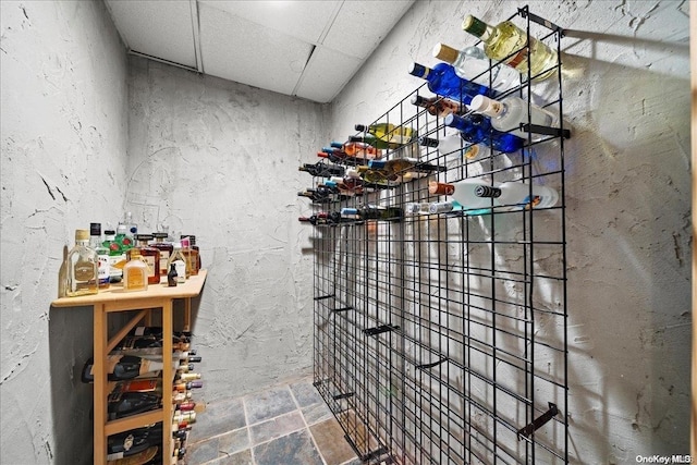 wine area with a paneled ceiling