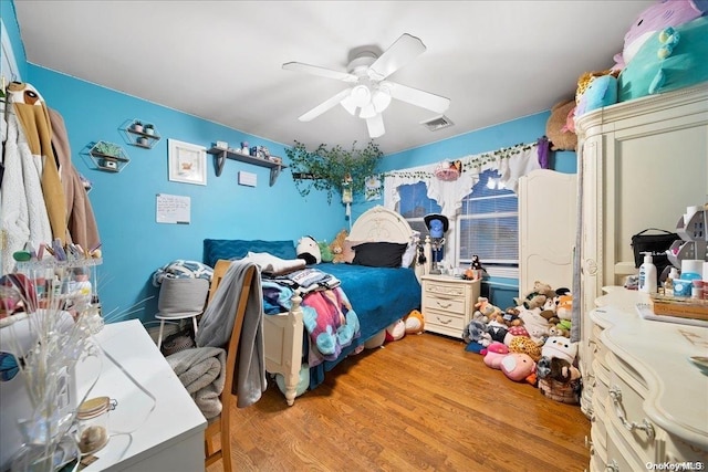 bedroom featuring ceiling fan and light wood-type flooring