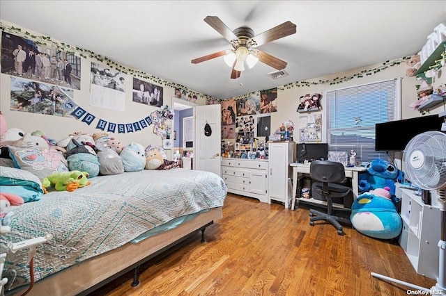 bedroom featuring light hardwood / wood-style floors and ceiling fan