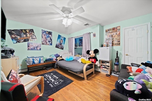 bedroom with ceiling fan and light wood-type flooring