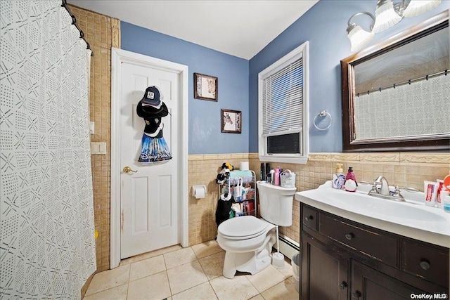 bathroom with vanity, tile patterned floors, toilet, baseboard heating, and tile walls