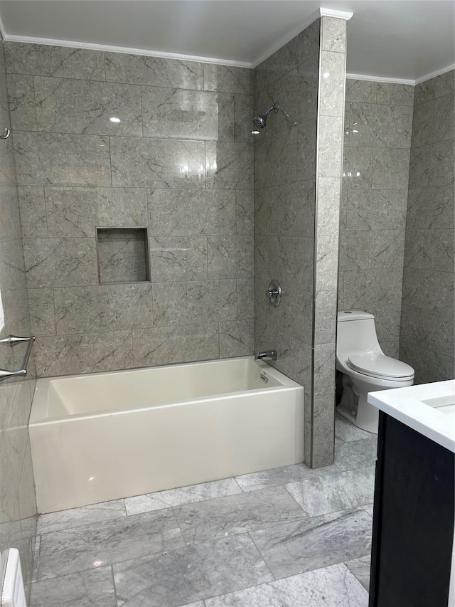 full bathroom featuring tiled shower / bath combo, vanity, and toilet