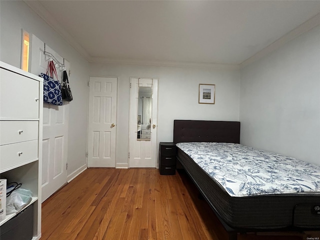 13 W Mill Dr Unit 3A, Great Neck, NY 11021 - bedroom featuring crown molding and wood finished floors