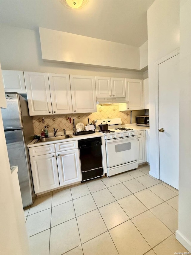 kitchen featuring sink, decorative backsplash, light tile patterned floors, white cabinetry, and stainless steel appliances