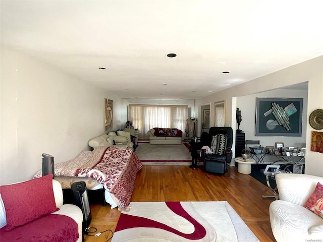 bedroom with hardwood / wood-style flooring