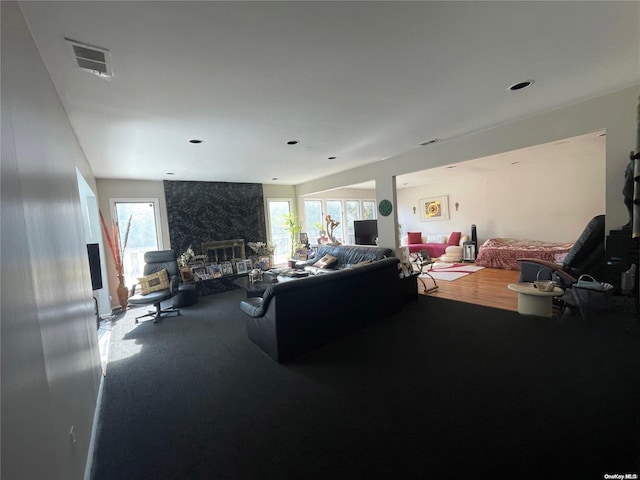 carpeted living room featuring plenty of natural light