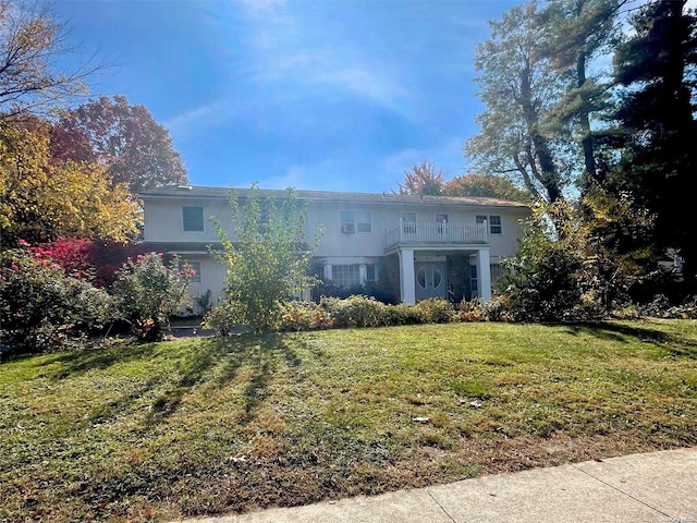 back of property featuring a lawn