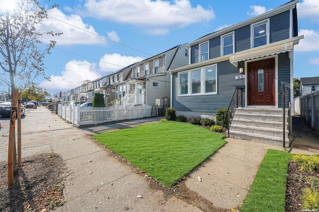 view of front of property with a front lawn