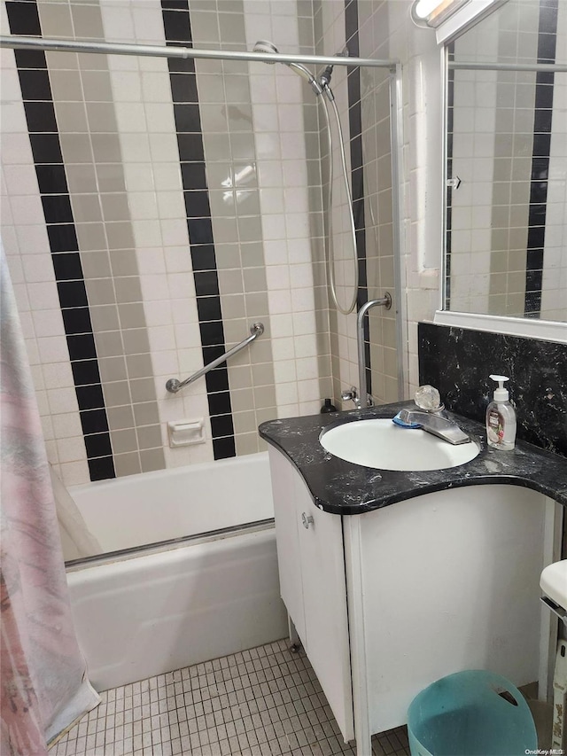 bathroom featuring tile patterned floors, vanity, and shower / bath combination with curtain