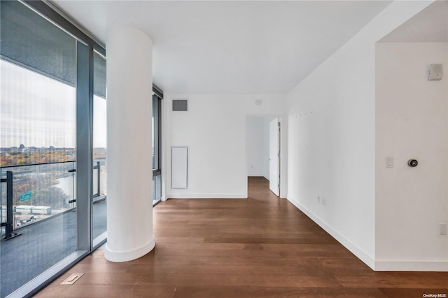 corridor with dark hardwood / wood-style floors