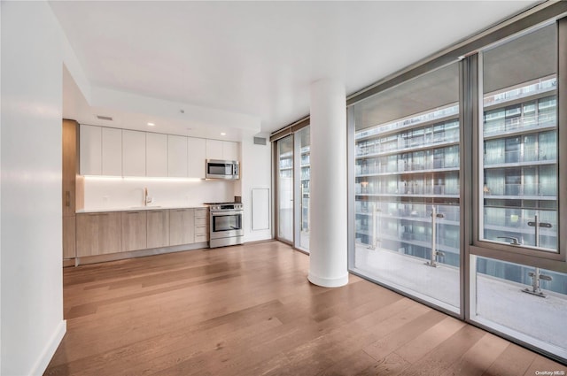 unfurnished living room with light hardwood / wood-style floors