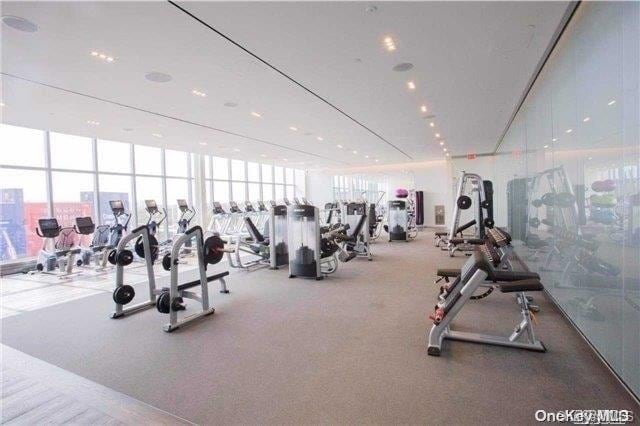 exercise room with a wall of windows