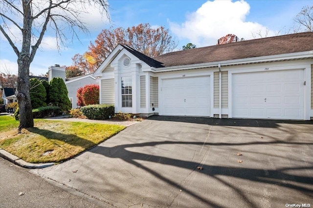 ranch-style home with a garage