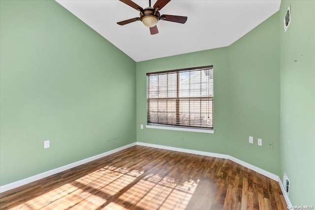 unfurnished room with ceiling fan, lofted ceiling, and dark wood-type flooring