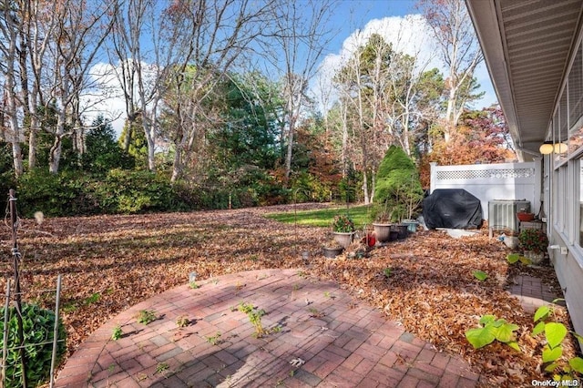 view of patio with central air condition unit and grilling area