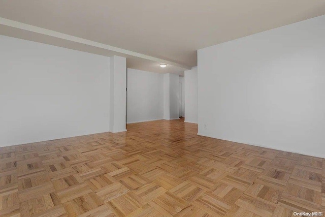 unfurnished room featuring light parquet floors