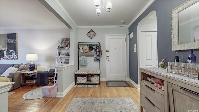 84-51 Beverly Rd Unit 4P, Kew Gardens, NY 11415 - entrance foyer with arched walkways, baseboards, and light wood-style floors