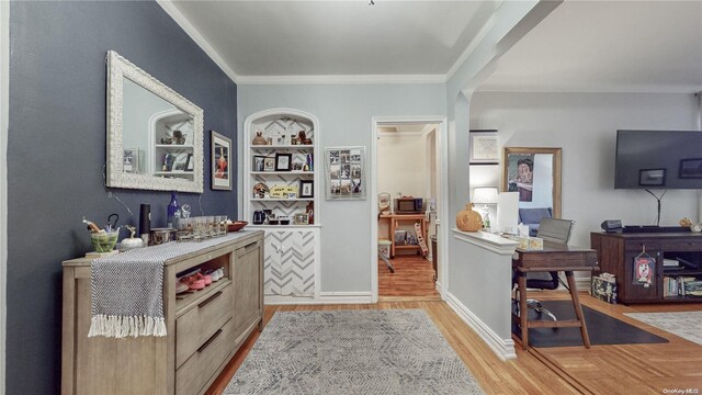84-51 Beverly Rd Unit 4P, Kew Gardens, NY 11415 - bar area featuring light wood-style floors, ornamental molding, and stainless steel microwave